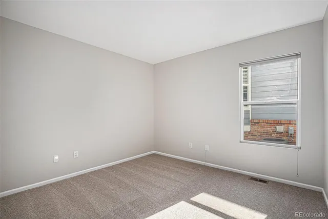 an empty room with a bathroom