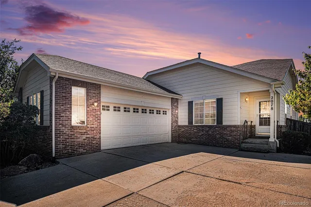 a view of a city with lush green forest