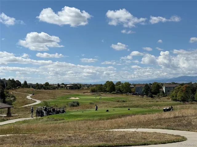 a view of a golf course with a lake