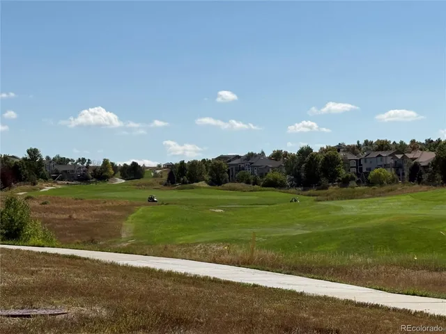 an aerial view of a house with a lake view