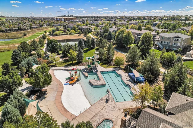 a view of house with a yard and sitting area
