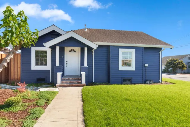 a front view of a house with a yard