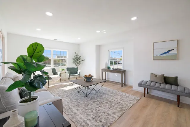 a living room with furniture and a rug