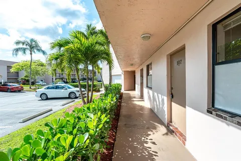 a view of a car parked in front of a building