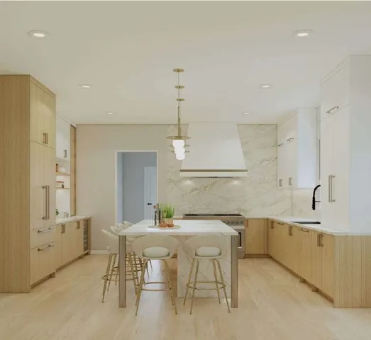 a kitchen with a table chairs sink and cabinets
