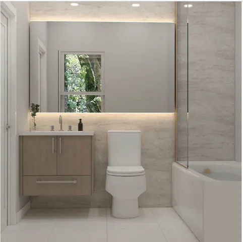 a bathroom with a sink a toilet and mirror