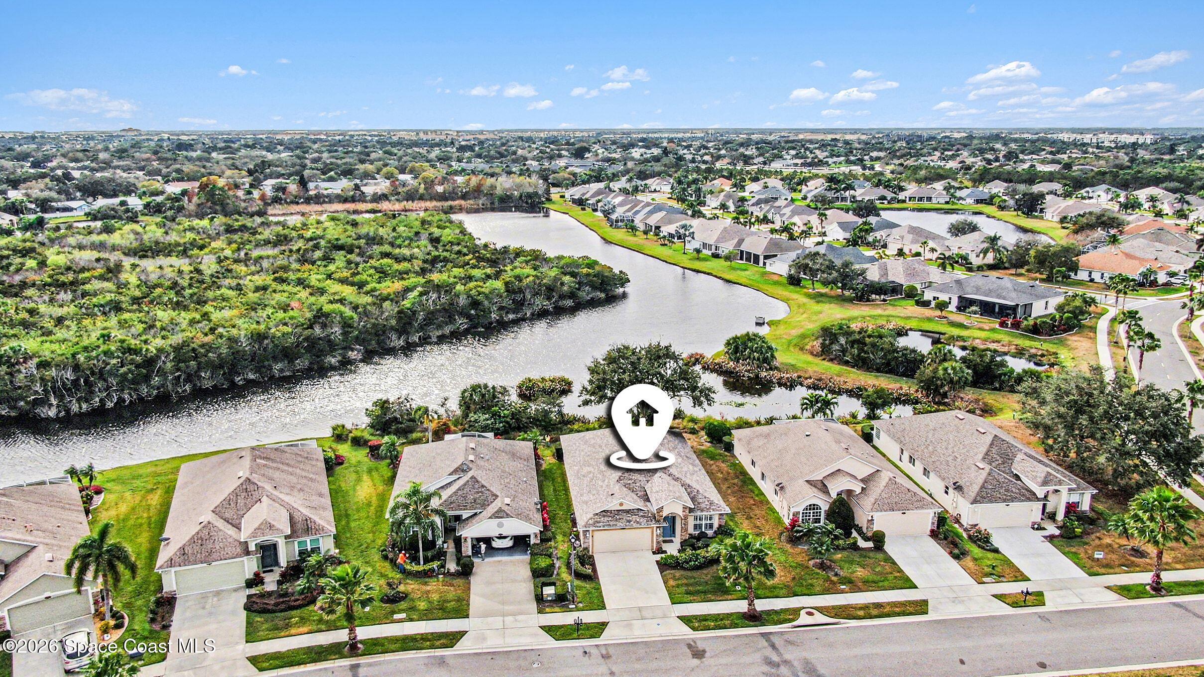 1424 Boca Rio Drive Melbourne, FL 32940 - Photo 7 of 50 an aerial view of residential houses with outdoor space and lake view