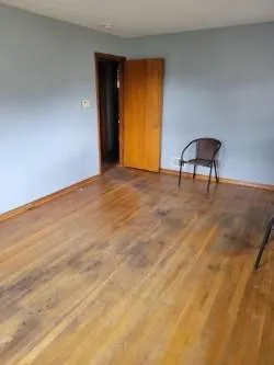 a view of a room with a bench and a window