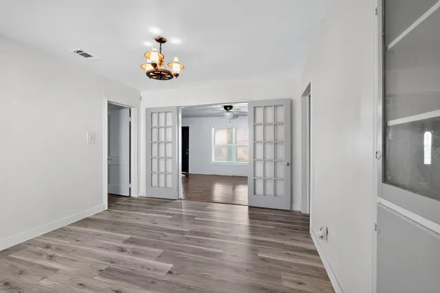 a view of an entryway with wooden floor