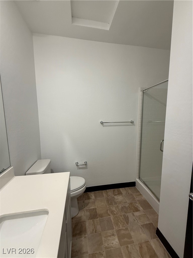 7368 North Decatur Boulevard, Unit 1 North Las Vegas, NV 89084 - Photo 9 of 17 Bathroom with a shower stall, vanity, and stone finish flooring