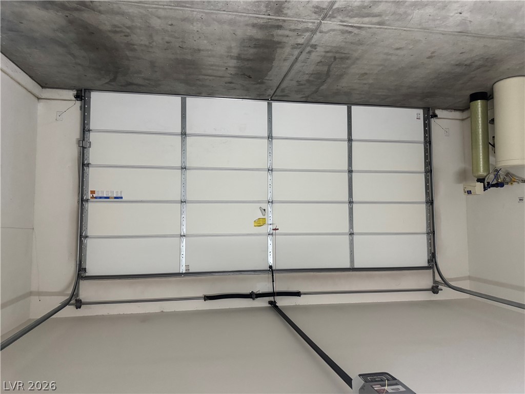 55 Canopus Ridge Way Las Vegas, NV 89183 - Photo 48 of 53 Concrete ceilings and durable epoxy floors define this functional garage space.