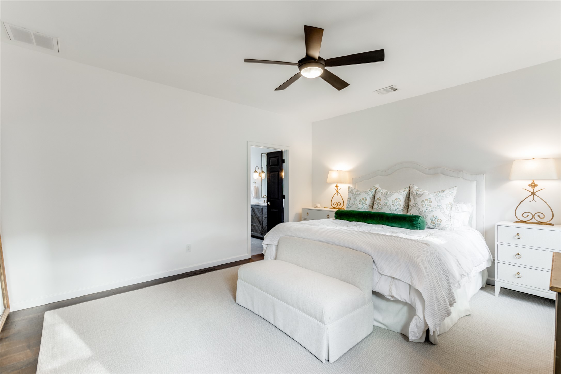 411 West St Elmo Road, Unit 35 Austin, TX 78745 - Photo 13 of 21 Bedroom with a ceiling fan and ensuite bath