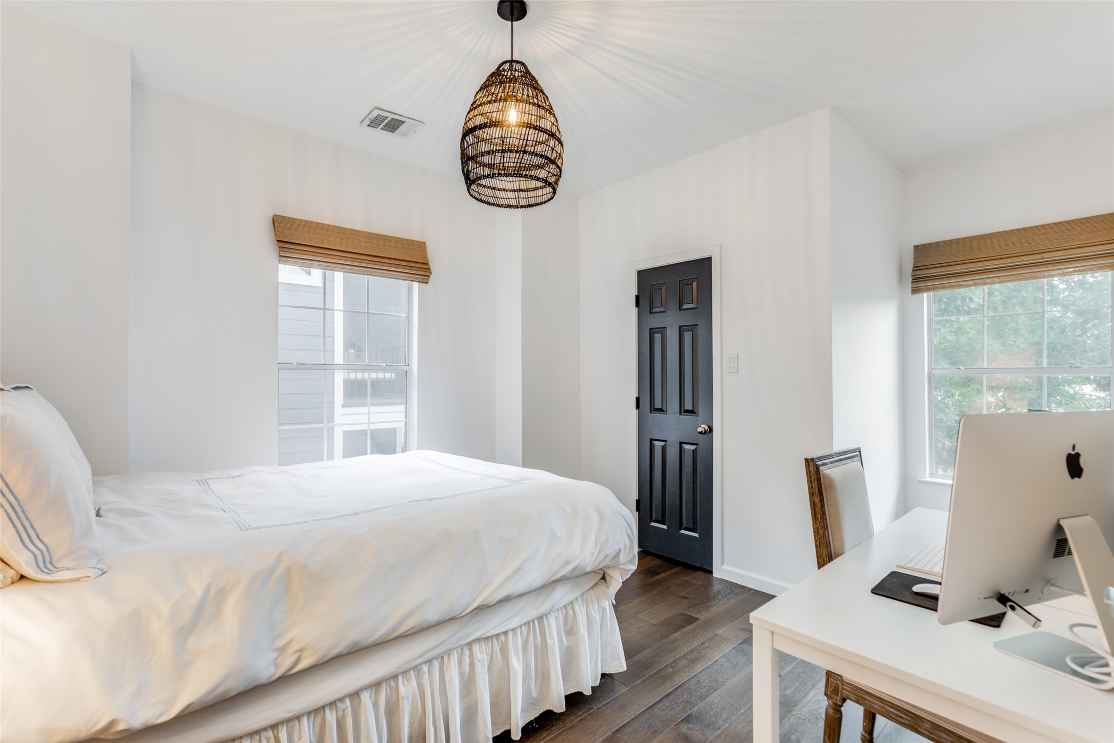 411 West St Elmo Road, Unit 35 Austin, TX 78745 - Photo 14 of 21 Bedroom featuring dark wood-style floors, suspended lighting, and a desk