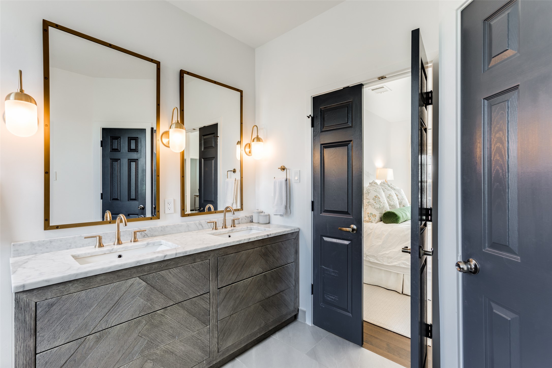 411 West St Elmo Road, Unit 35 Austin, TX 78745 - Photo 17 of 21 Ensuite bathroom with double vanity and light tile patterned floors