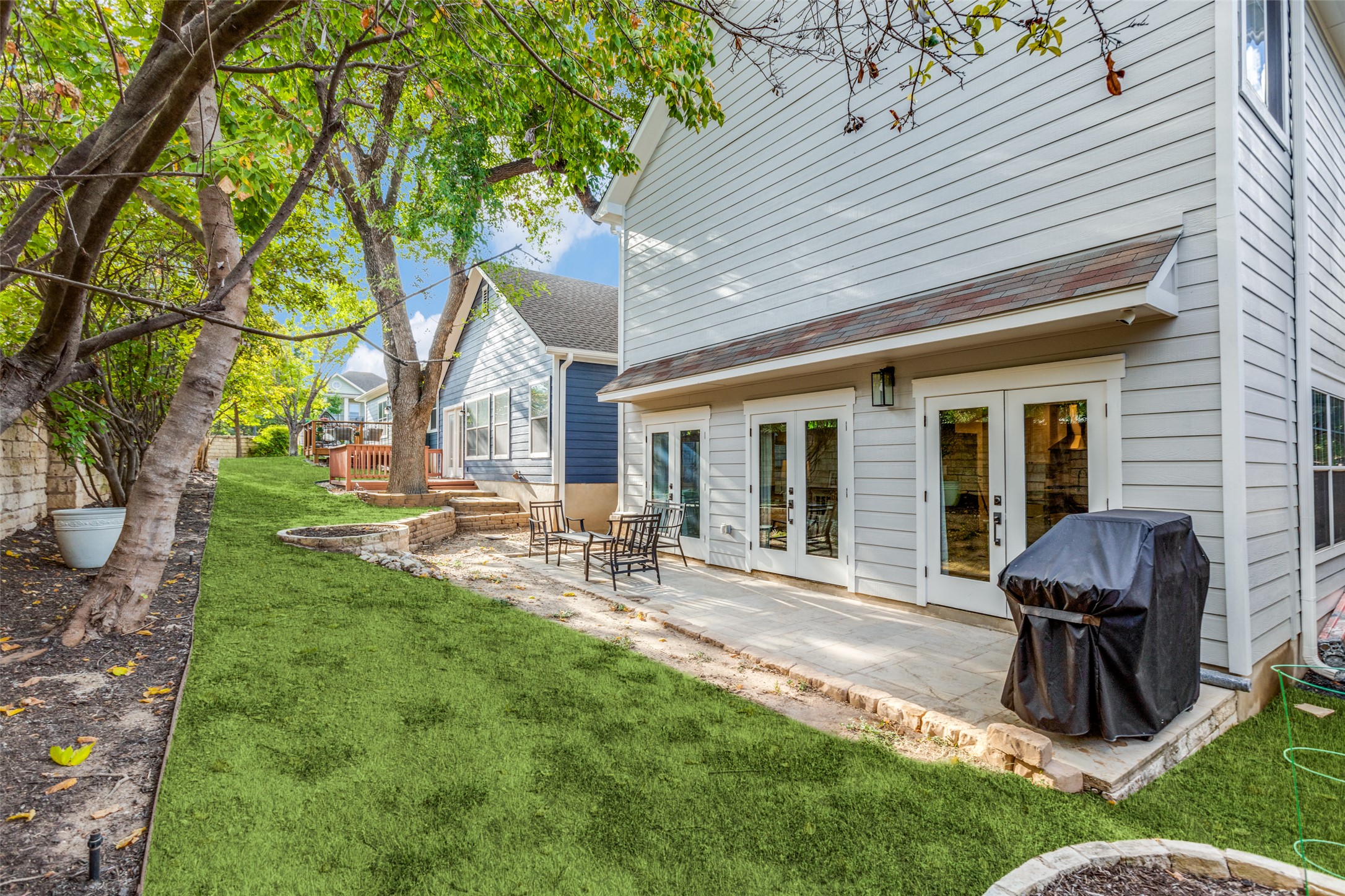 411 West St Elmo Road, Unit 35 Austin, TX 78745 - Photo 21 of 21 Back of property with french doors, a patio, and a yard