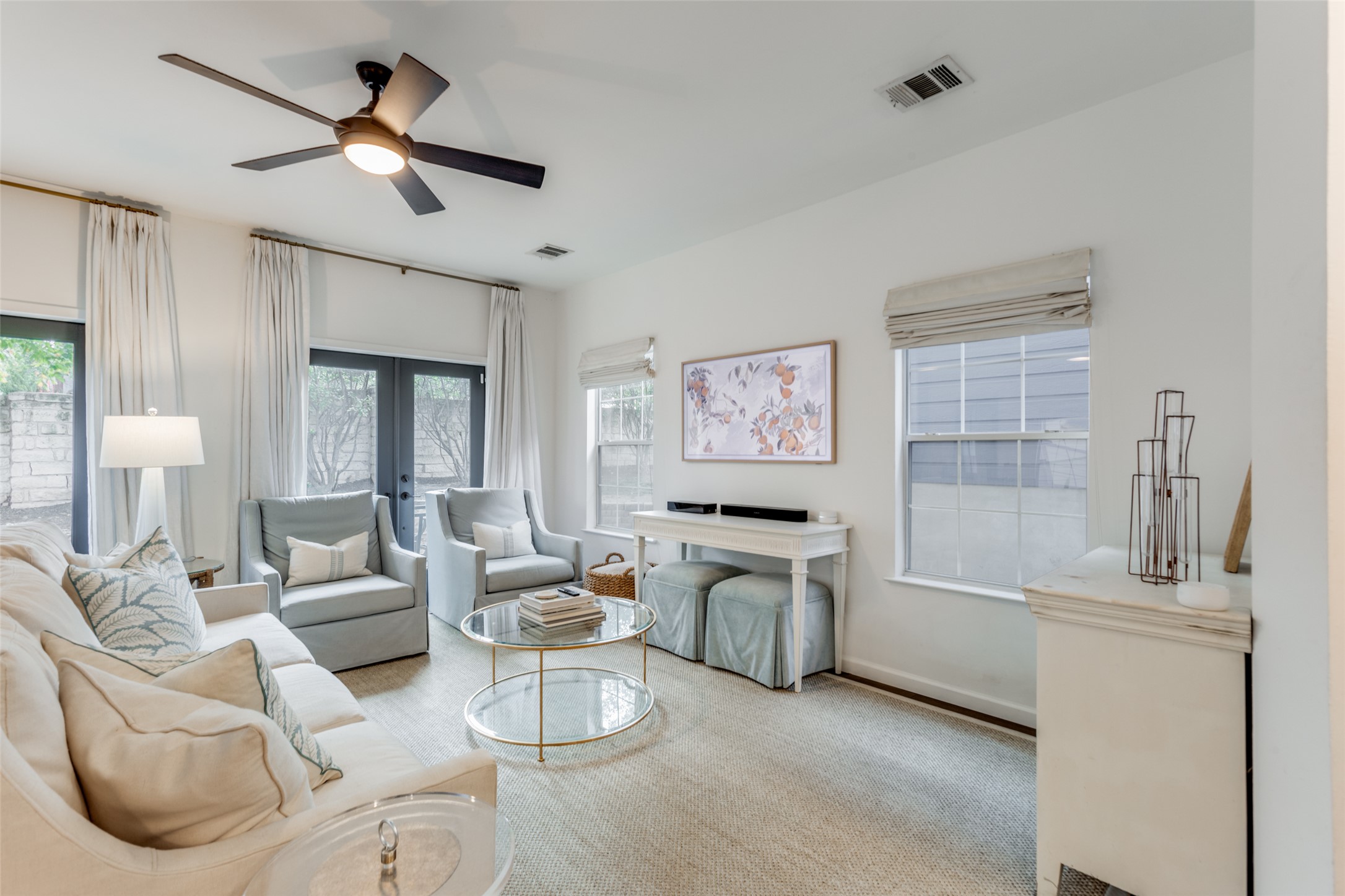 411 West St Elmo Road, Unit 35 Austin, TX 78745 - Photo 5 of 21 Living room featuring a ceiling fan and french doors