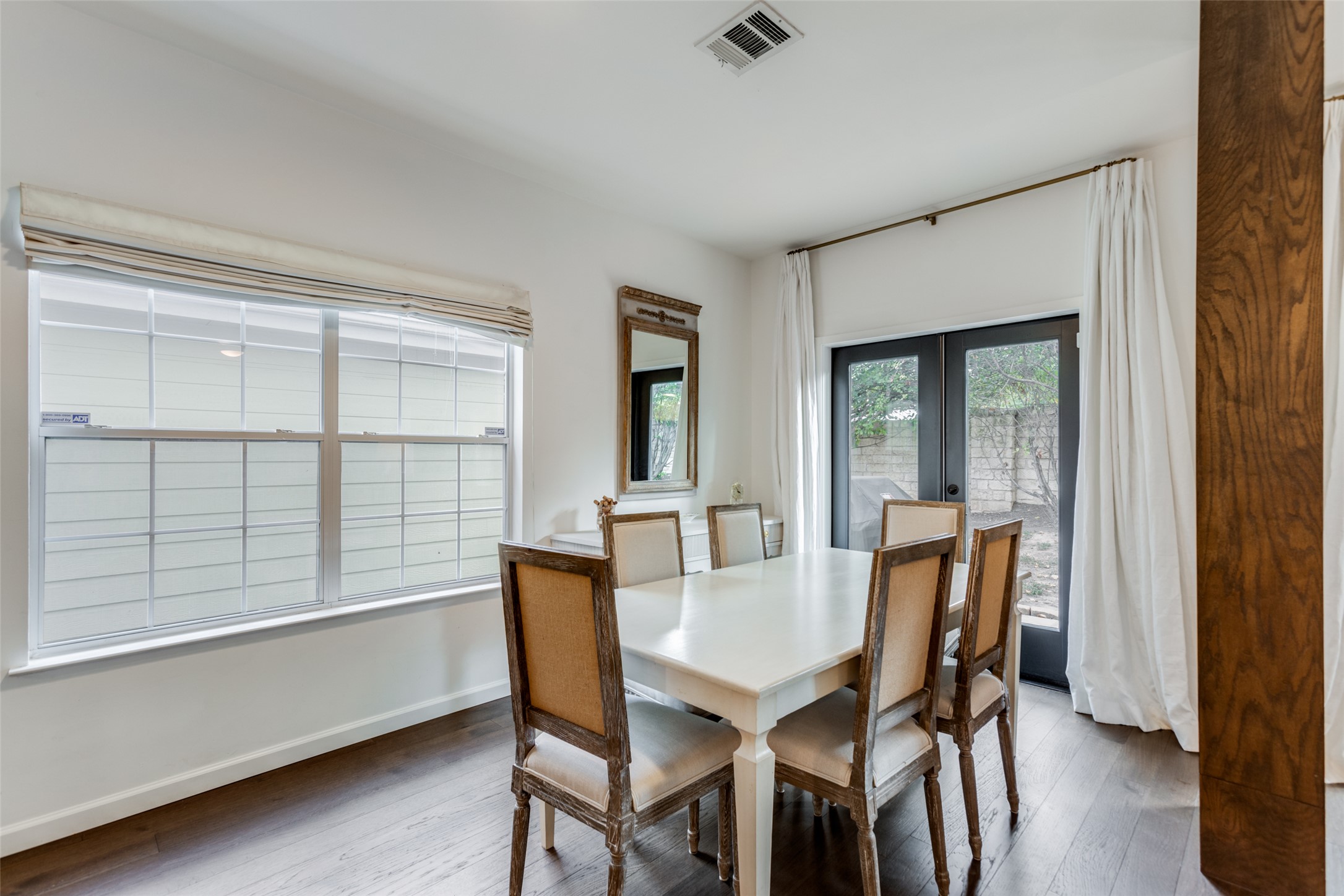411 West St Elmo Road, Unit 35 Austin, TX 78745 - Photo 8 of 21 Dining area featuring french doors and hardwood / wood-style floors