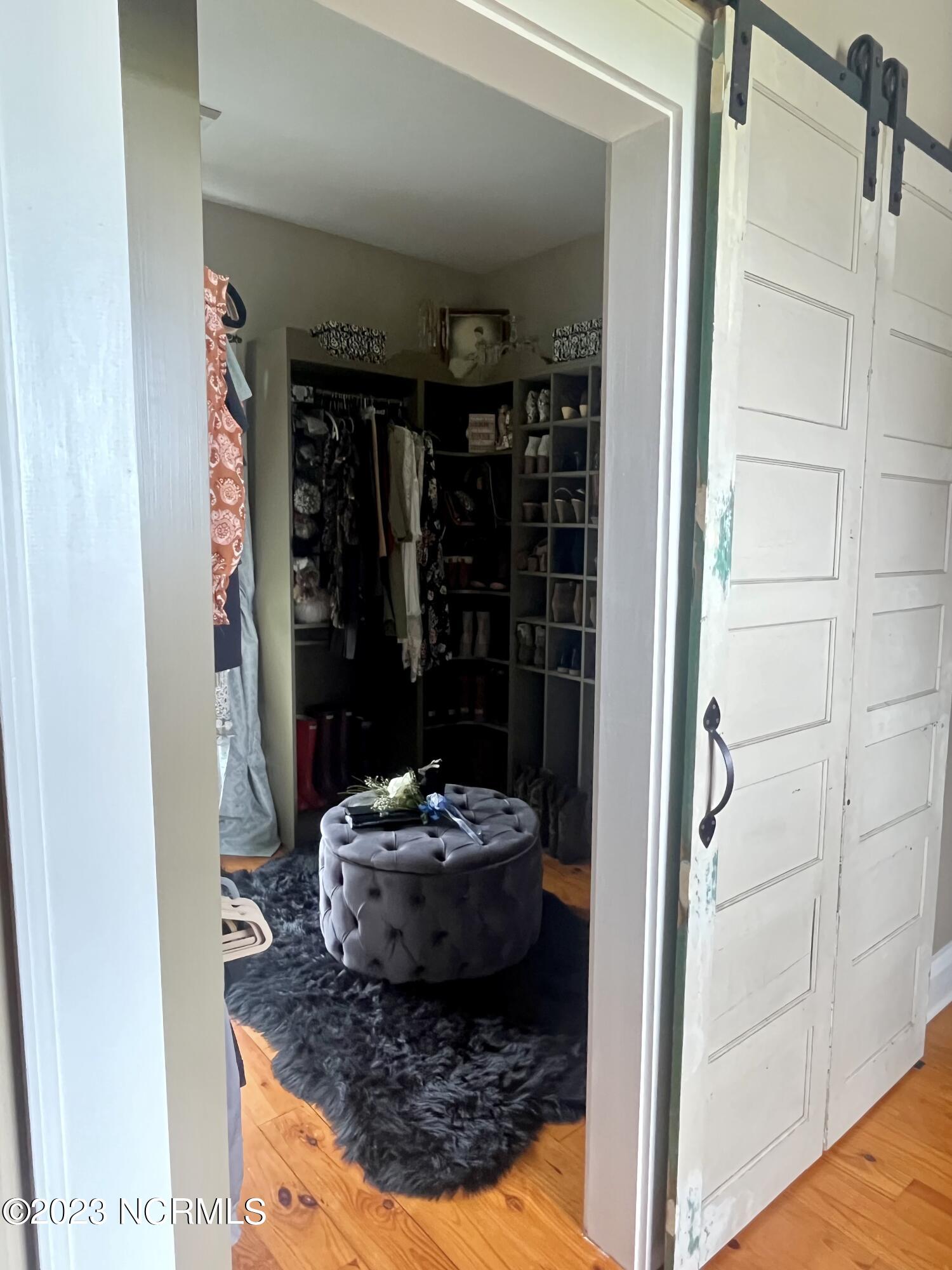 142 Drewery Road Como, NC 27818 - Photo 60 of 113 Barn door opens to a walk-in closet or nursery