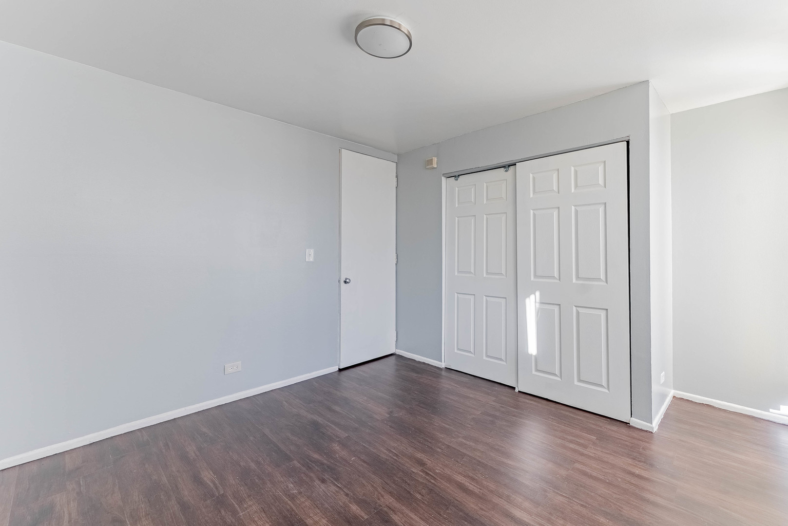 1320 West Arthington Street, Unit 1 Chicago, IL 60607 - Photo 11 of 19 a view of an empty room with wooden floor