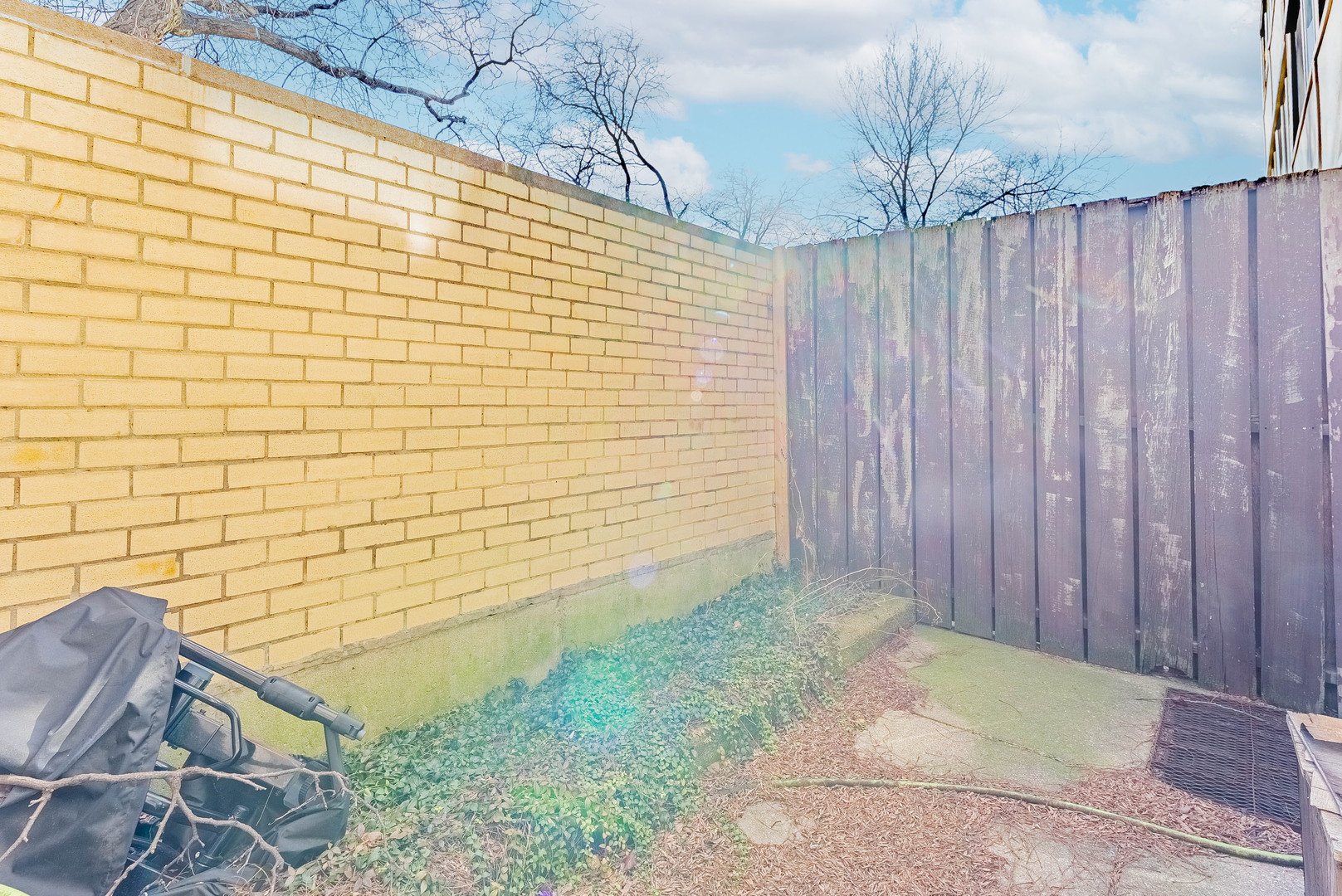1320 West Arthington Street, Unit 1 Chicago, IL 60607 - Photo 12 of 19 a view of a pathway with a wooden fence