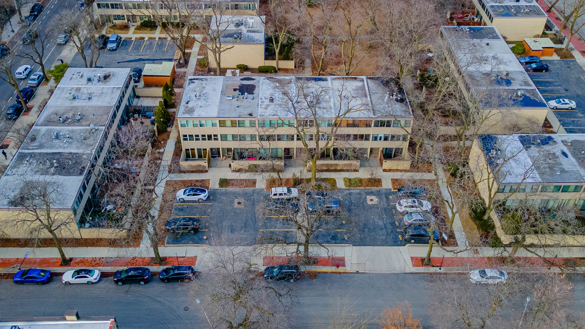 1320 West Arthington Street, Unit 1 Chicago, IL 60607 - Photo 16 of 19 an aerial view of a building with parking