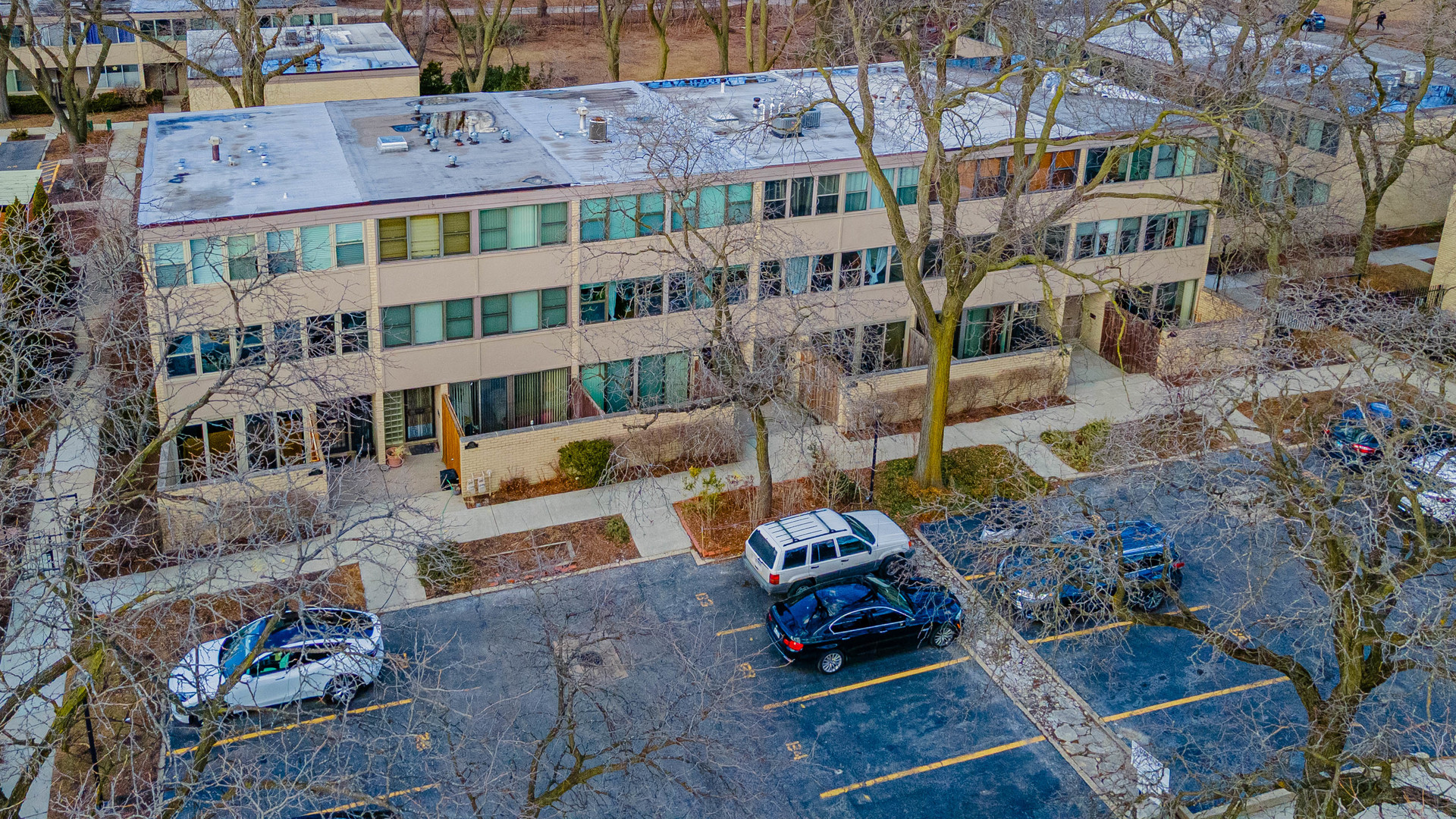 1320 West Arthington Street, Unit 1 Chicago, IL 60607 - Photo 18 of 19 an aerial view of a brick house with many windows