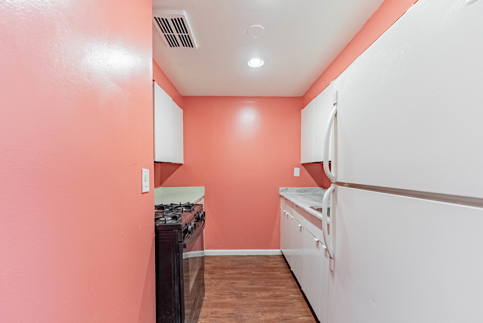 1320 West Arthington Street, Unit 1 Chicago, IL 60607 - Photo 5 of 19 a kitchen with stainless steel appliances granite countertop a refrigerator and a stove