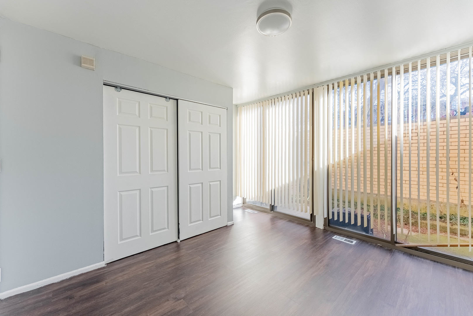 1320 West Arthington Street, Unit 1 Chicago, IL 60607 - Photo 10 of 19 an empty room with wooden floor and windows