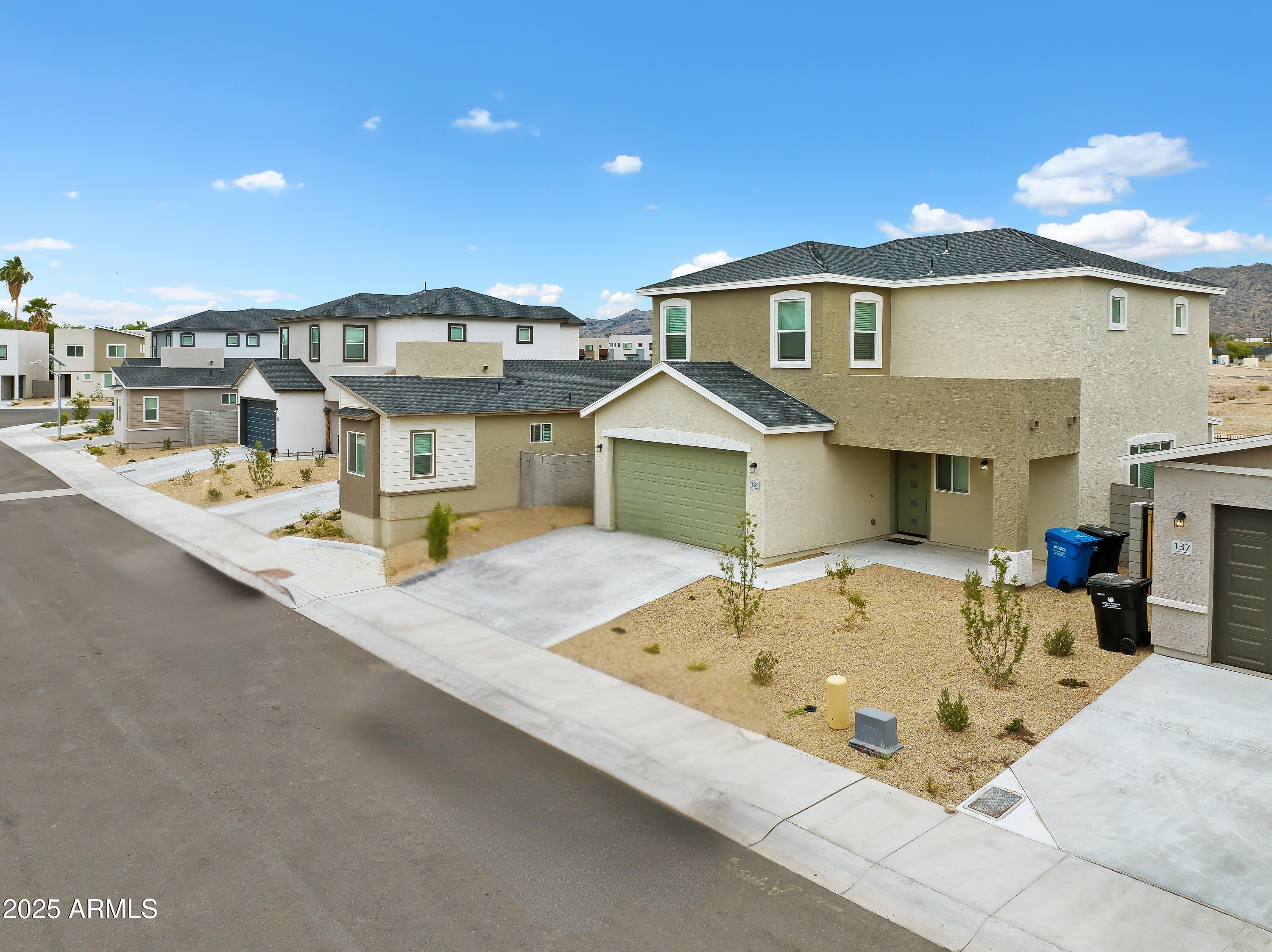 141 West Latona Road Phoenix, AZ 85041 - Photo 2 of 13 a front view of a house with entertaining space