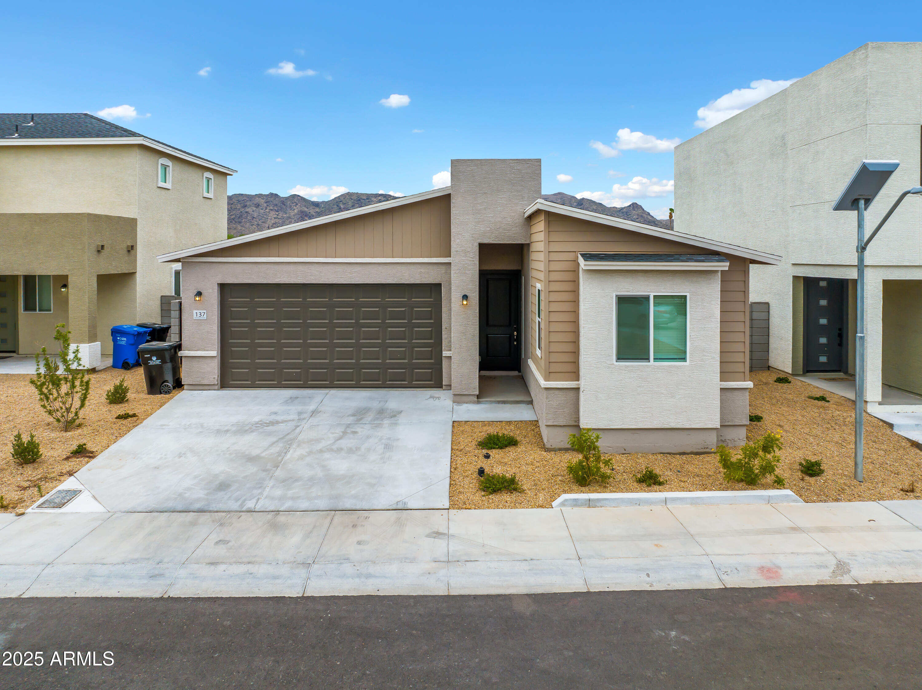 141 West Latona Road Phoenix, AZ 85041 - Photo 3 of 13 a front view of a house with yard