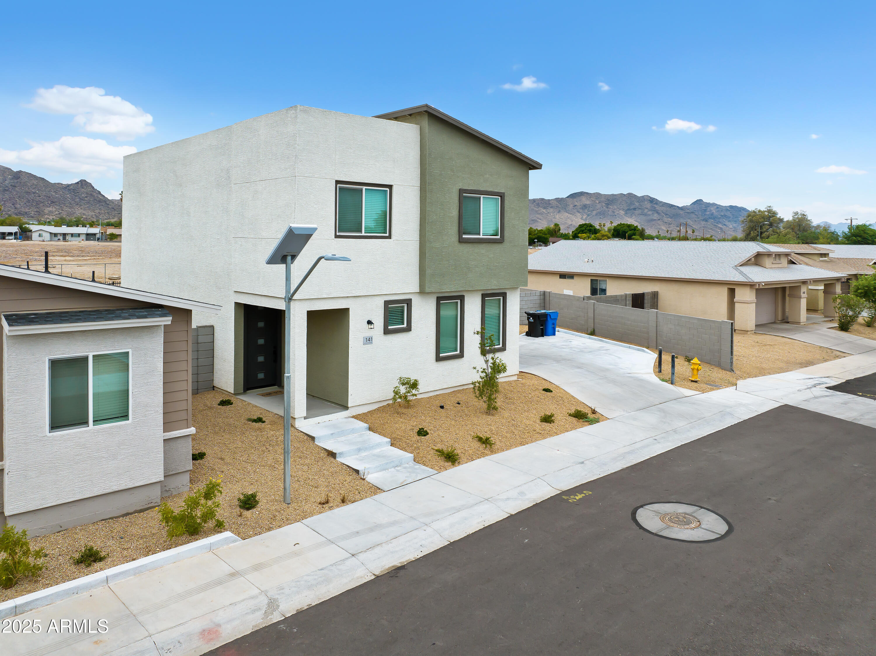 141 West Latona Road Phoenix, AZ 85041 - Photo 4 of 13 a view of a house with a sink and roof