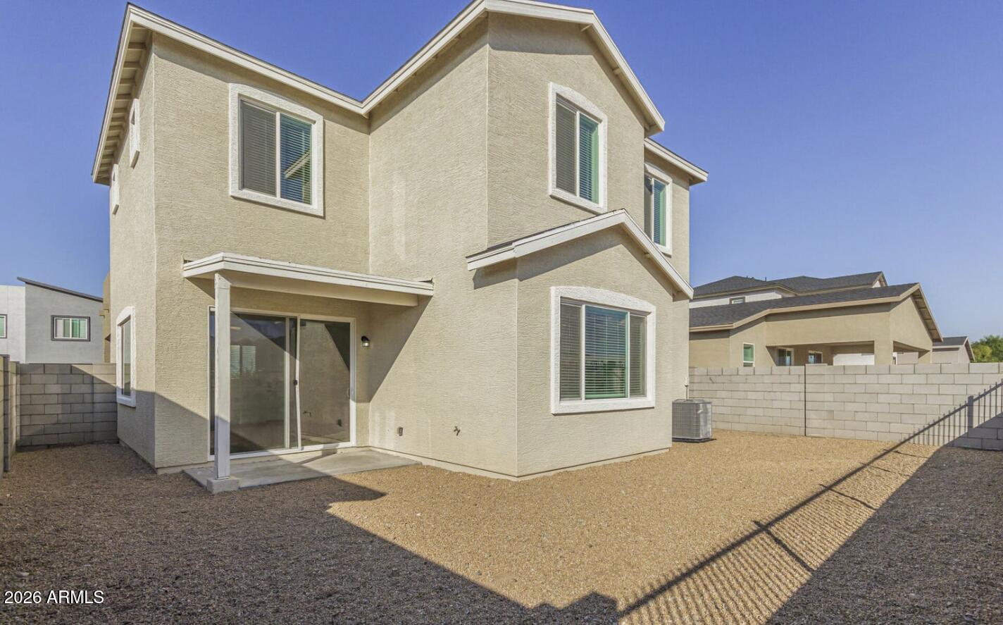 141 West Latona Road Phoenix, AZ 85041 - Photo 7 of 13 a view of a house with a backyard
