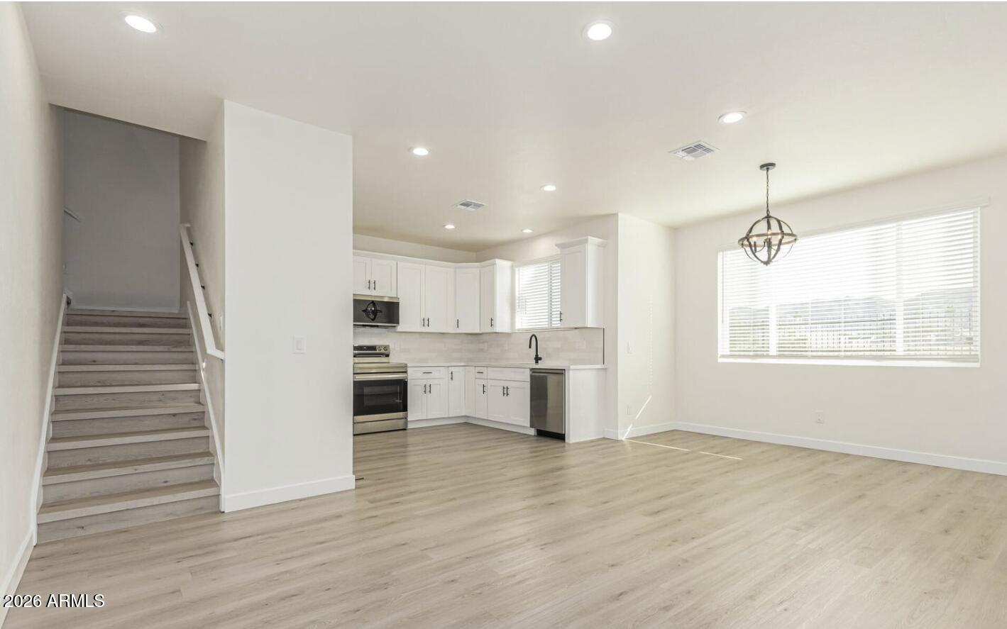 141 West Latona Road Phoenix, AZ 85041 - Photo 10 of 13 a view of a kitchen with electric appliances