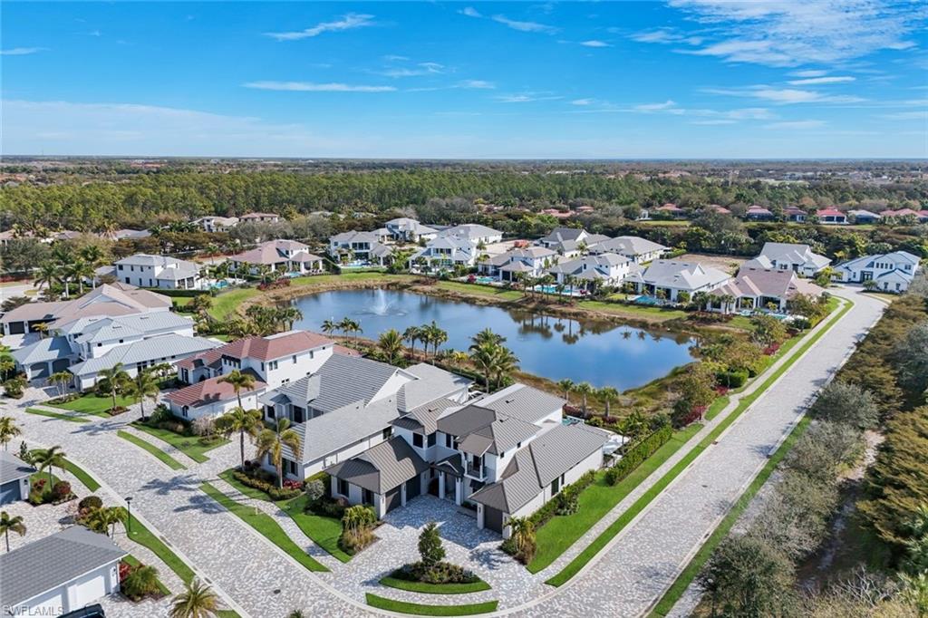 16728 Enclave Circle Naples, FL 34110 - Photo 2 of 49 Aerial perspective of suburban area featuring a nearby body of water