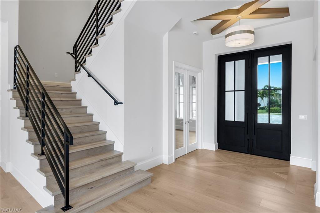 16728 Enclave Circle Naples, FL 34110 - Photo 6 of 49 Entrance foyer with french doors and light wood-type flooring