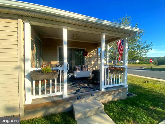 a view of a chair and tables in the patio