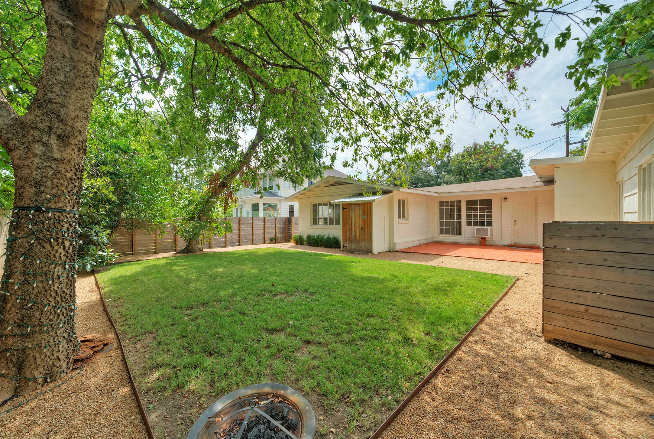 1803 Pearl Street Austin, TX 78701 - Photo 27 of 33 a backyard of a house with seating space