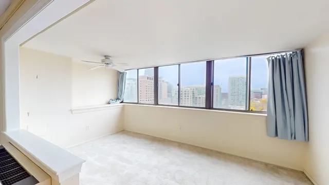 a view of an empty room with a window