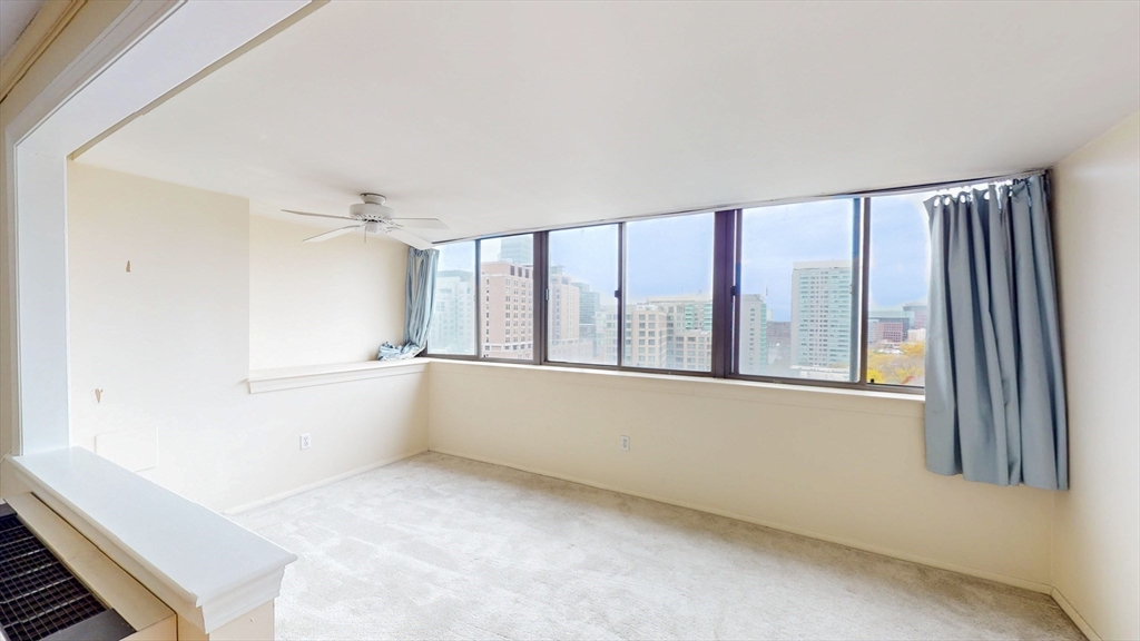 9 Hawthorne Place, Unit 11B Boston, MA 02114 - Photo 14 of 19 a view of an empty room with a window