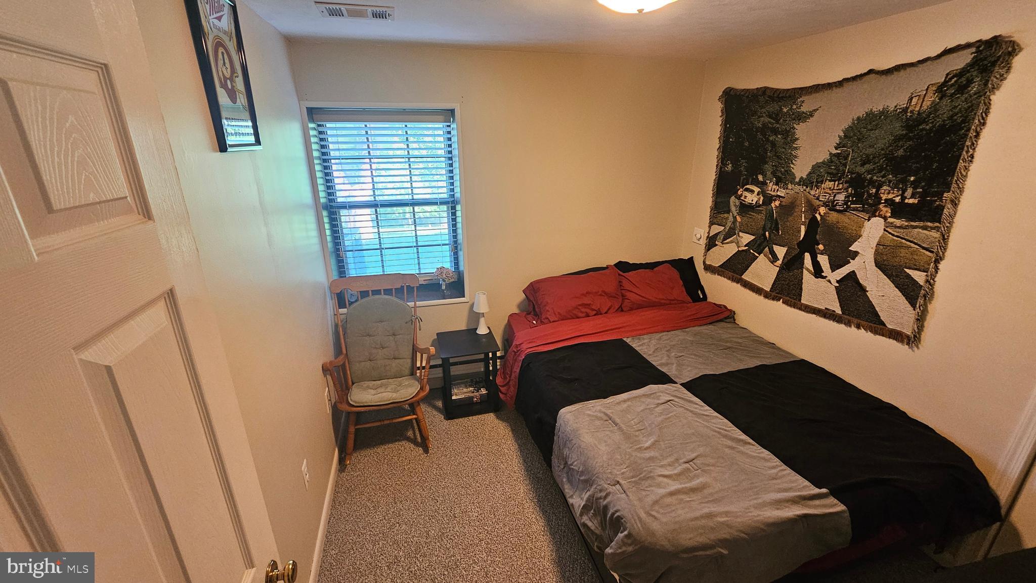 10921 Dumbarton Drive Dunkirk, MD 20754 - Photo 12 of 20 a bedroom with a bed and a window