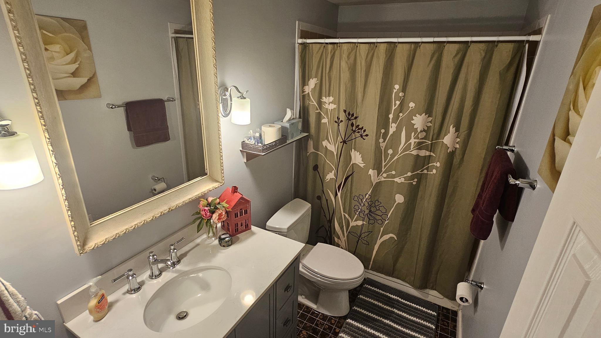 10921 Dumbarton Drive Dunkirk, MD 20754 - Photo 14 of 20 a bathroom with a sink toilet and shower