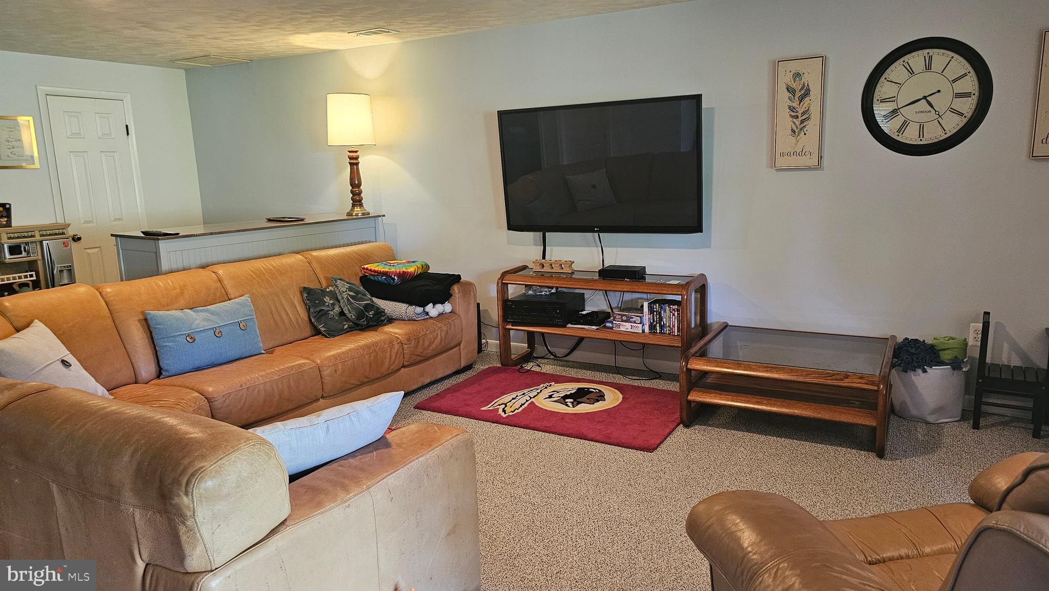 10921 Dumbarton Drive Dunkirk, MD 20754 - Photo 17 of 20 a living room with furniture and a flat screen tv