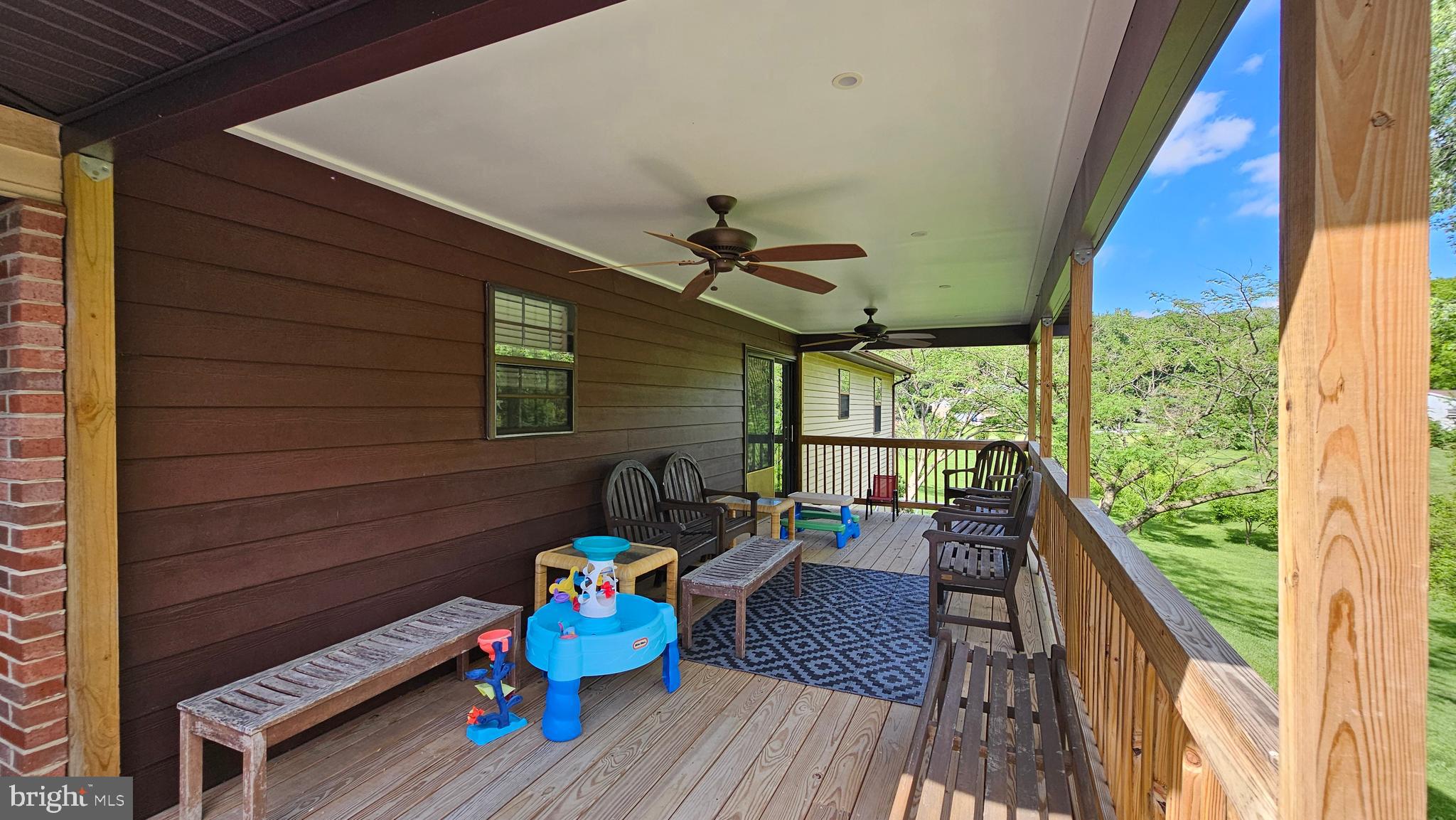 10921 Dumbarton Drive Dunkirk, MD 20754 - Photo 4 of 20 a balcony with wooden floor and outdoor seating