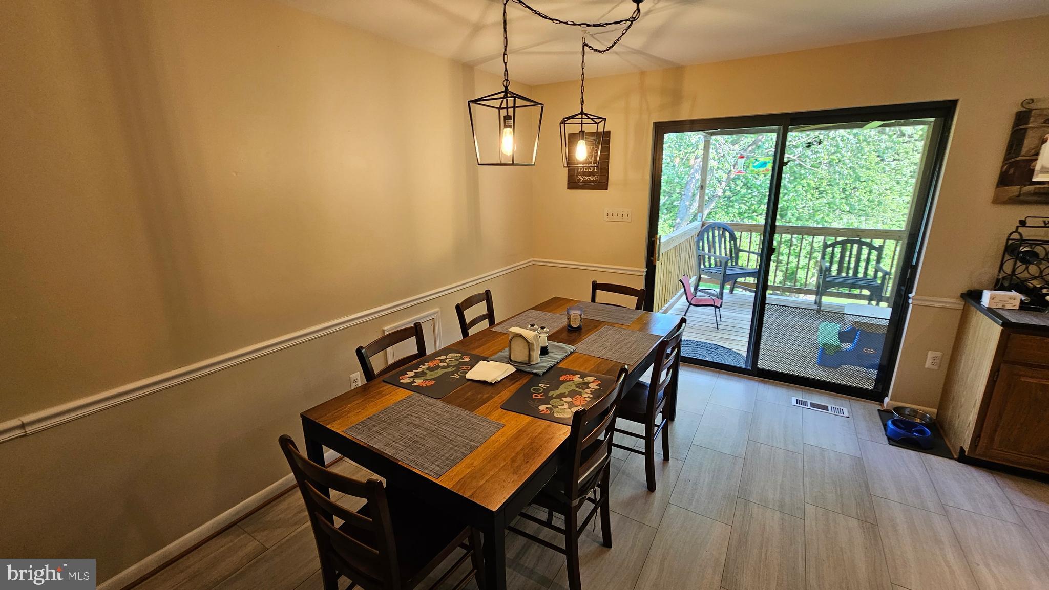 10921 Dumbarton Drive Dunkirk, MD 20754 - Photo 8 of 20 a view of a dining room with furniture window and wooden floor