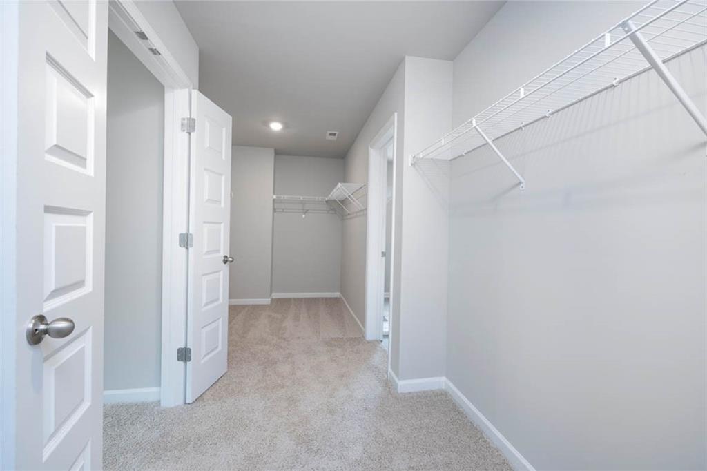 113 Canal Street Hampton, GA 30228 - Photo 22 of 33 a view of a hallway with closet area