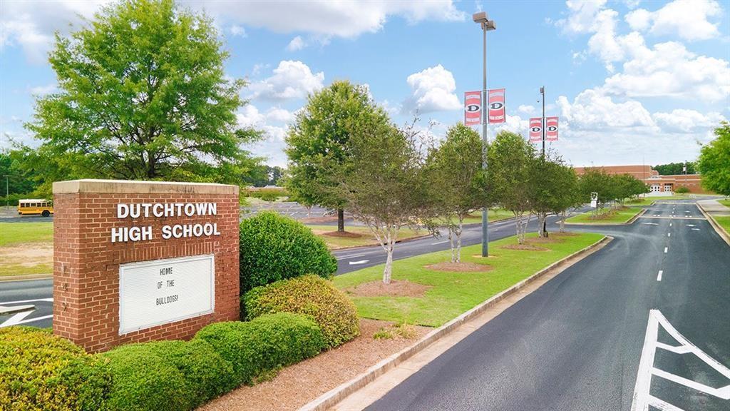 113 Canal Street Hampton, GA 30228 - Photo 32 of 33 a view of a swimming pool with a garden and plants