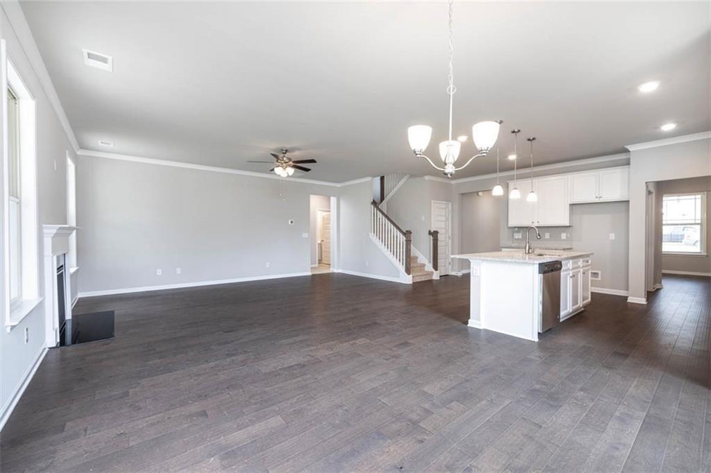113 Canal Street Hampton, GA 30228 - Photo 9 of 33 a view of a kitchen with a sink and a chandelier