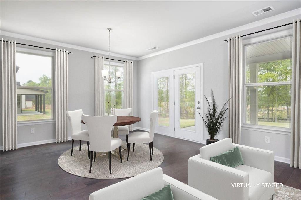 113 Canal Street Hampton, GA 30228 - Photo 10 of 33 a living room with furniture and a potted plant