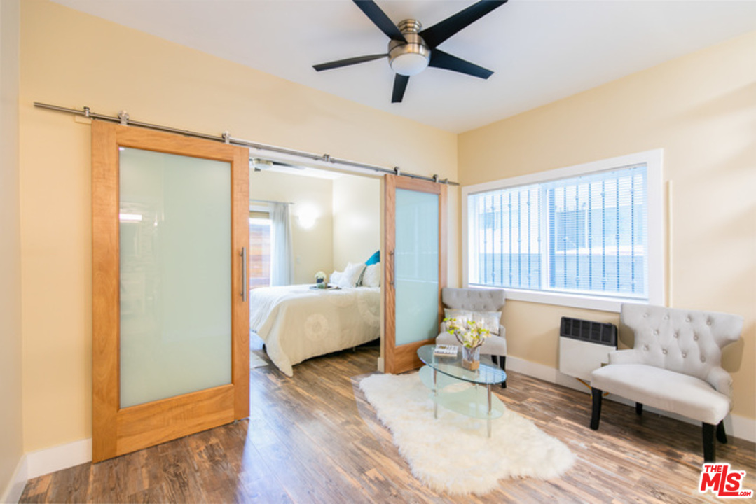 40 Westminster Avenue Venice, CA 90291 - Photo 3 of 10 a bedroom with furniture and a large window
