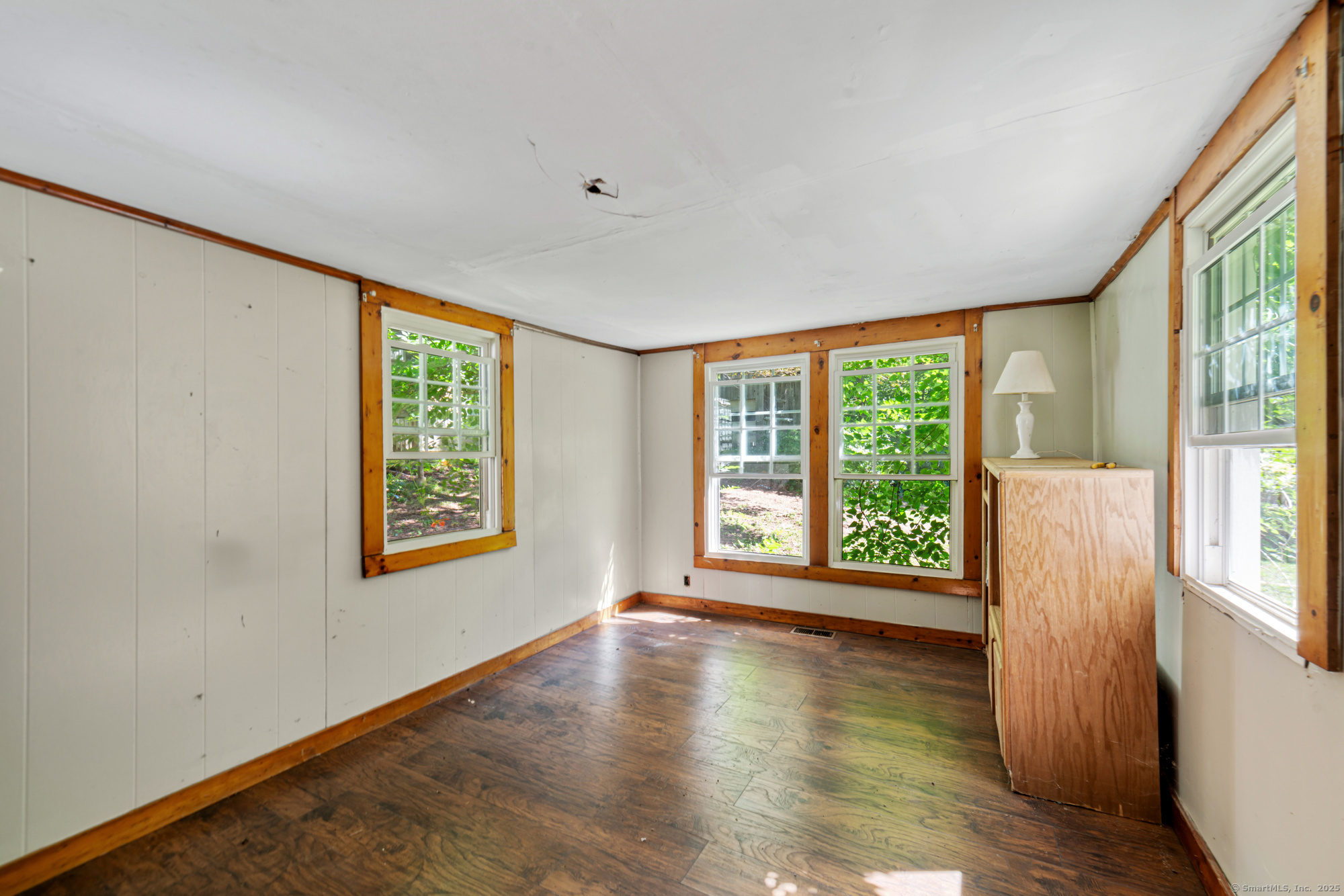 28 Trumbull Street Litchfield, CT 06750 - Photo 19 of 23 a view of an empty room with wooden floor and a window